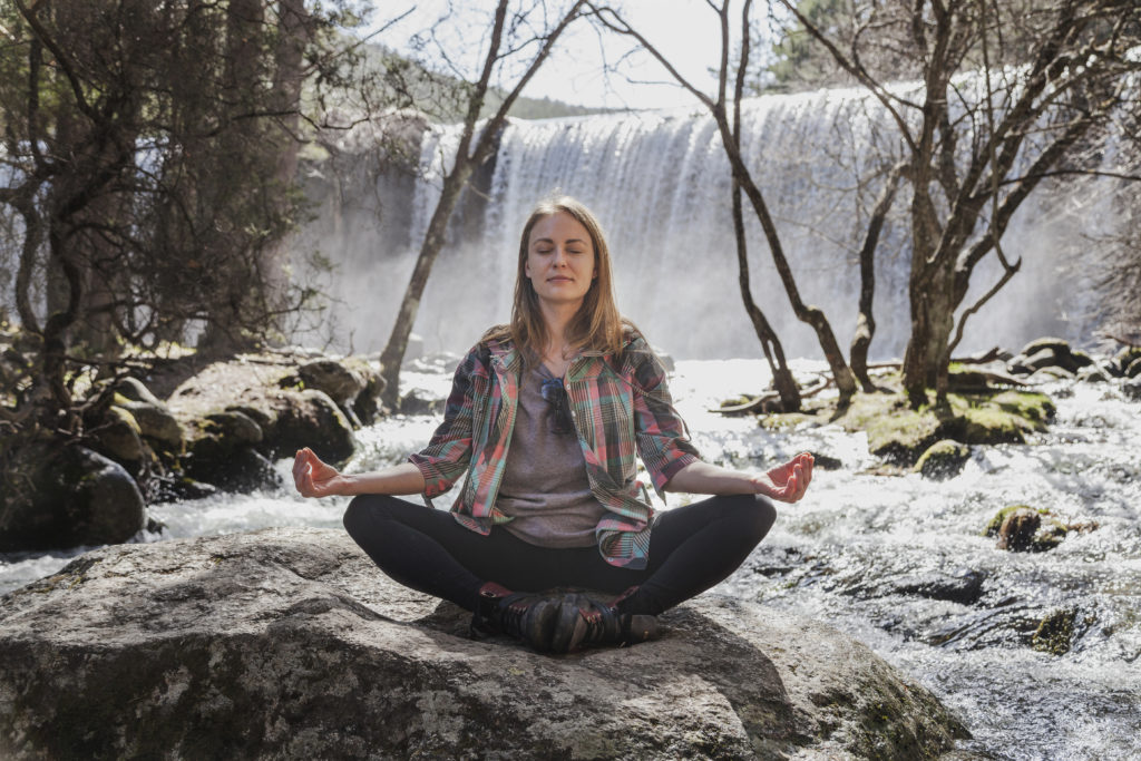 woman sitting yoga posture outdoors